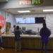 Picture of students in front of the counter for Pita Pit